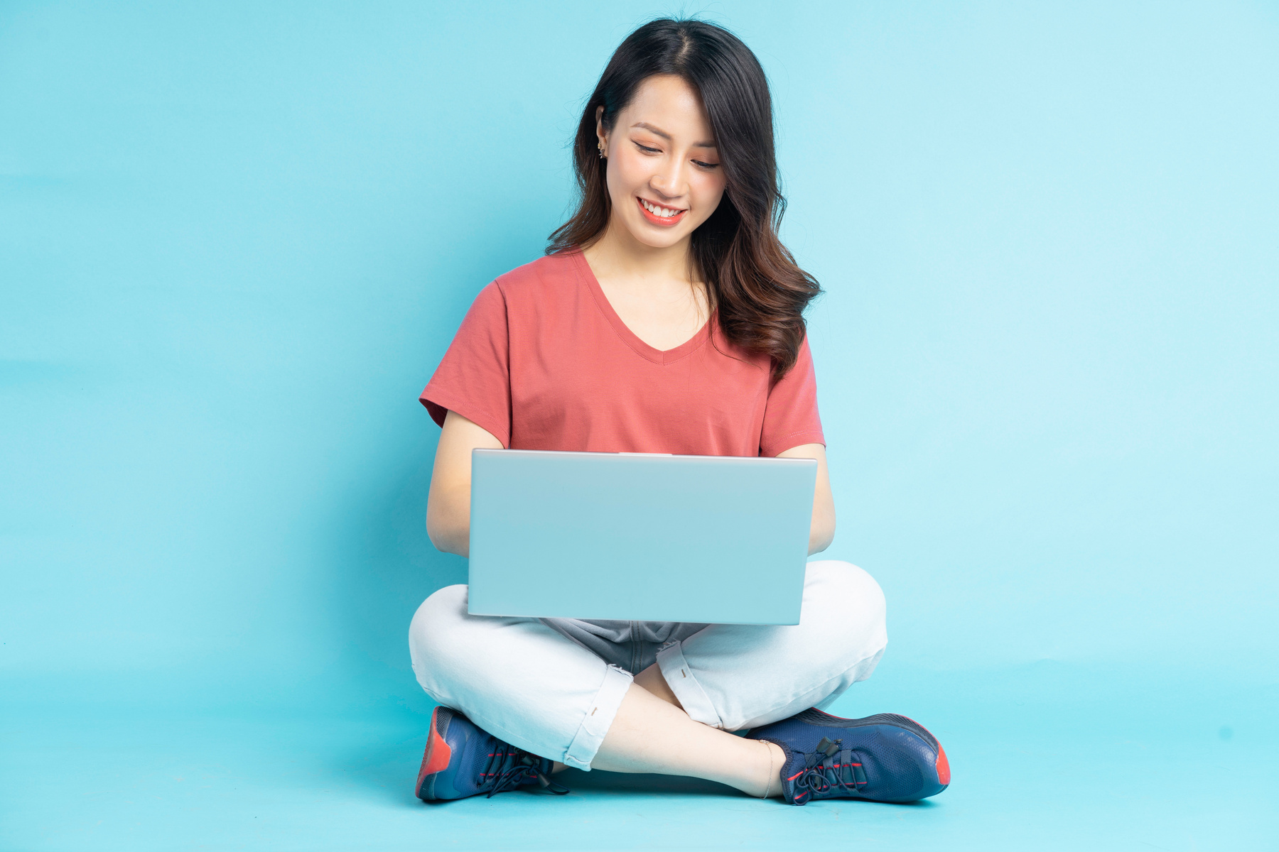 Beautiful Asian Woman Sitting Working with Laptop