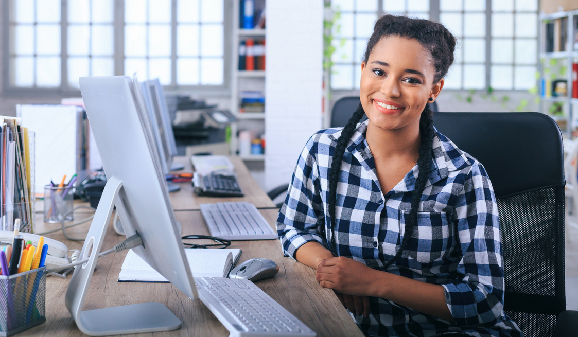 Smiling african office assistant